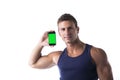 Attractive young man showing his cell phone's blank green screen Royalty Free Stock Photo