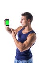 Attractive young man showing his cell phone's Royalty Free Stock Photo