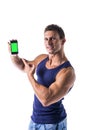 Attractive young man showing his cell phone's Royalty Free Stock Photo