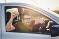 Attractive young man showing his new car keys and smiling Royalty Free Stock Photo