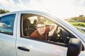 Attractive young man showing his new car keys and smiling Royalty Free Stock Photo