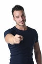 Attractive young man smiling and pointing finger at you Royalty Free Stock Photo