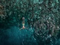 attractive young man snorkels in the ocean and observes the coral world, free diver in the sea, coral reefs in the Maldives Royalty Free Stock Photo