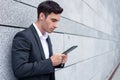 Attractive young man in suit is working with Royalty Free Stock Photo