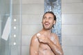 Attractive young man taking shower with soap Royalty Free Stock Photo