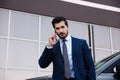 Attractive young man  on phone near luxury car outdoors Royalty Free Stock Photo