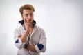 Attractive young man thinking, looking up with hand on his chin Royalty Free Stock Photo