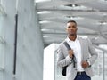 Attractive young man walking with bag Royalty Free Stock Photo