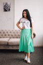 Attractive young model demonstrating clothes. Spring colections on elegant brunette woman