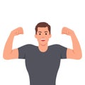 Attractive young muscular man flexing biceps and smiling happy Royalty Free Stock Photo