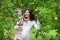 Attractive young pregnant woman holding her baby daughter Royalty Free Stock Photo