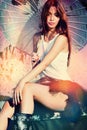 Attractive young redhead woman with parasol outdoor summer day