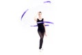Attractive young rhythmic gymnast in leotard training with blue ribbon
