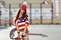 Attractive young smiling woman with guitar Royalty Free Stock Photo