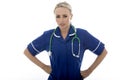 Attractive Young Stern Unhappy Woman Posing As A Doctor or Nurse Royalty Free Stock Photo