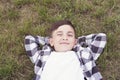 Cute teenager boy relaxing in park