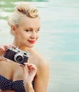 Attractive young woman on the beach with vintage details, travel Royalty Free Stock Photo