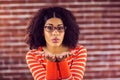 Attractive young woman blowing kiss Royalty Free Stock Photo