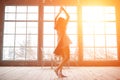 Attractive young woman dancing near huge wondows at her apartment Royalty Free Stock Photo