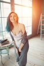 Attractive young woman dancing near huge wondows at her apartment Royalty Free Stock Photo