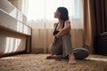 Attractive young woman doing yoga stretching yoga online at home Royalty Free Stock Photo