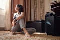 Attractive young woman doing yoga stretching yoga online at home Royalty Free Stock Photo