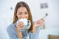 Attractive young woman drinking coffee Royalty Free Stock Photo