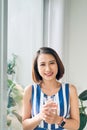 Attractive young woman drinking coffee at home Royalty Free Stock Photo