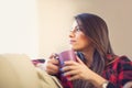 Attractive young woman drinking coffee at home Royalty Free Stock Photo