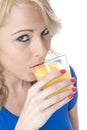 Attractive Young Woman Drinking Orange Juice Royalty Free Stock Photo