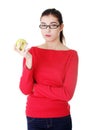 Attractive young woman eating green apple. Royalty Free Stock Photo