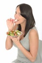 Attractive Young Woman Eating a Plate of Healthy Fresh Chicken Salad Royalty Free Stock Photo