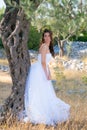 Attractive young woman enjoying her time outside in olive trees. Royalty Free Stock Photo