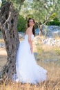 Attractive young woman enjoying her time outside in olive trees. Royalty Free Stock Photo