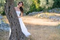 Attractive young woman enjoying her time outside in olive trees. Royalty Free Stock Photo