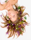 Attractive young woman face with flowers Royalty Free Stock Photo