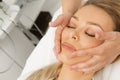 Attractive young woman getting face massage at the spa Royalty Free Stock Photo