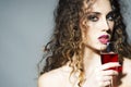 Attractive young woman with glass of red wine Royalty Free Stock Photo