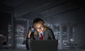 Attractive young woman in glasses sitting at desk Royalty Free Stock Photo