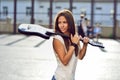 Attractive young woman with guitar - outdoor fashion portrait Royalty Free Stock Photo