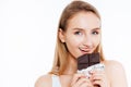 Attractive young woman holding chocolate bar Royalty Free Stock Photo