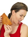 Attractive Young Woman Holding a Cooked Cornish Pasty Snack