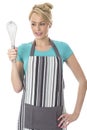 Attractive Young Woman Holding a kitchen Whisk Royalty Free Stock Photo