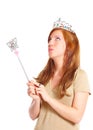 Attractive young woman holding magic wand Royalty Free Stock Photo