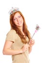 Attractive young woman holding a magic wand Royalty Free Stock Photo