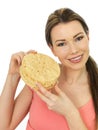 Attractive Young Woman Holding A Pile Of Indian Style Poppadoms Royalty Free Stock Photo