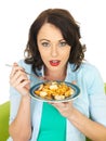 Attractive Young Woman Holding a Plate of Seafood Linguine Royalty Free Stock Photo