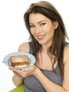 Attractive Young Woman Holding a Slice of Gala Pie Royalty Free Stock Photo