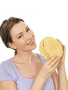 Attractive Young Woman Holding A Stack Of Indian Style Poppadoms Royalty Free Stock Photo