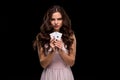 Attractive young woman holding the winning combination of poker cards Royalty Free Stock Photo